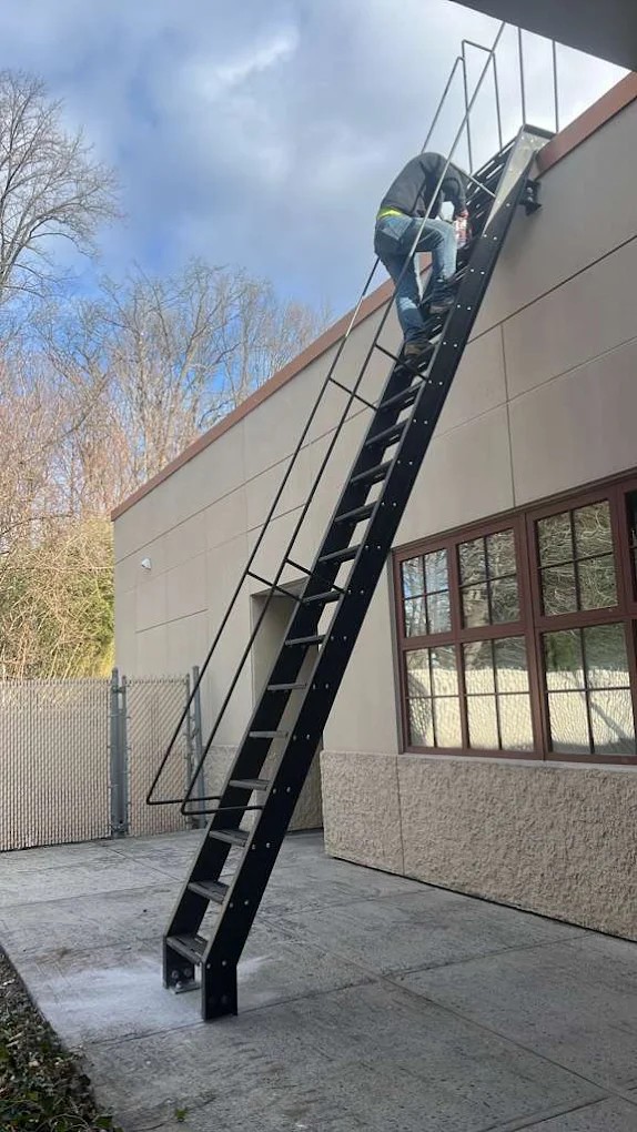 Steel railing installation by Steel Masters NYC on a Brooklyn, NY rooftop terrace