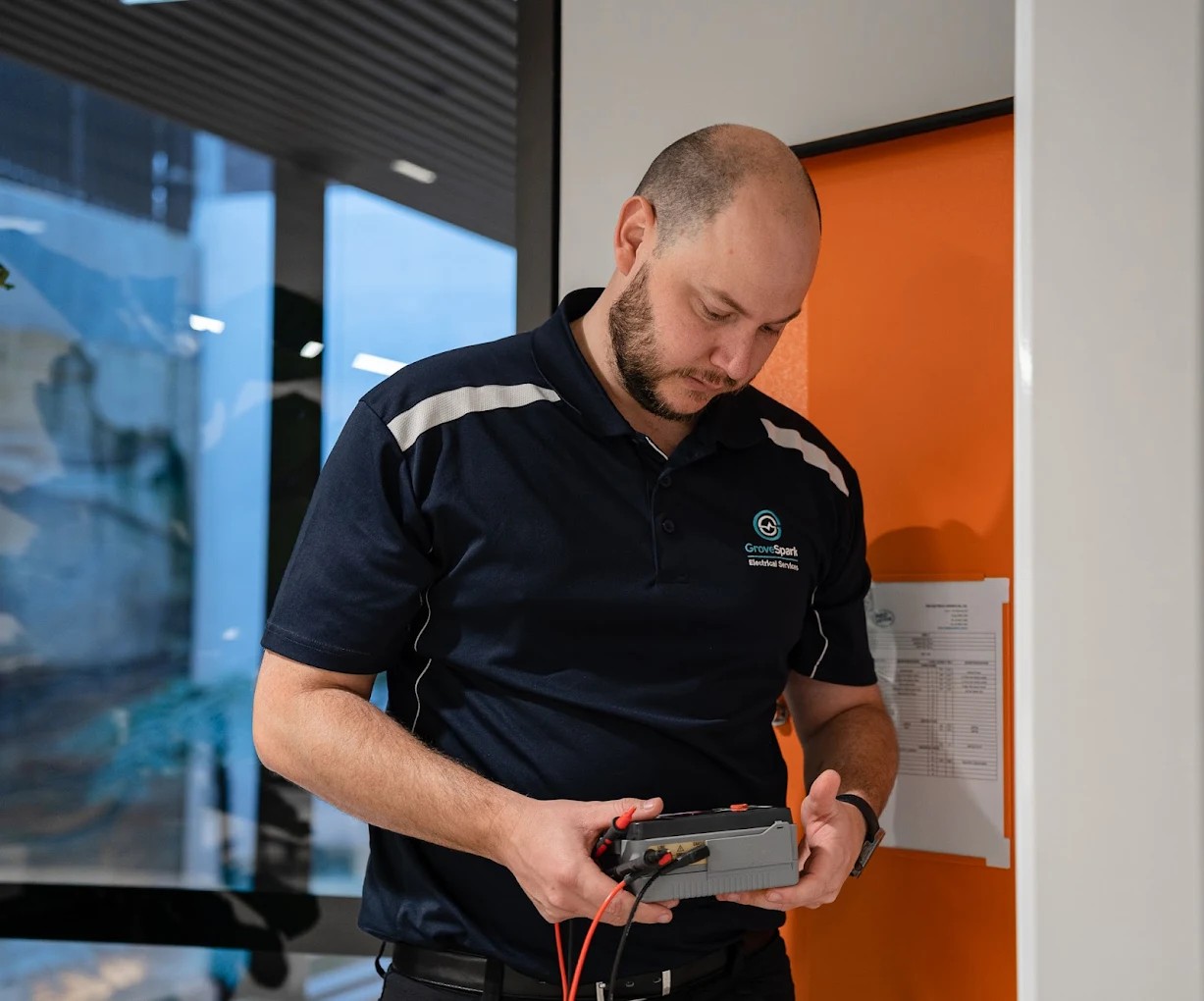 Electrician Chatswood — qualified technician testing wiring in a North Shore home