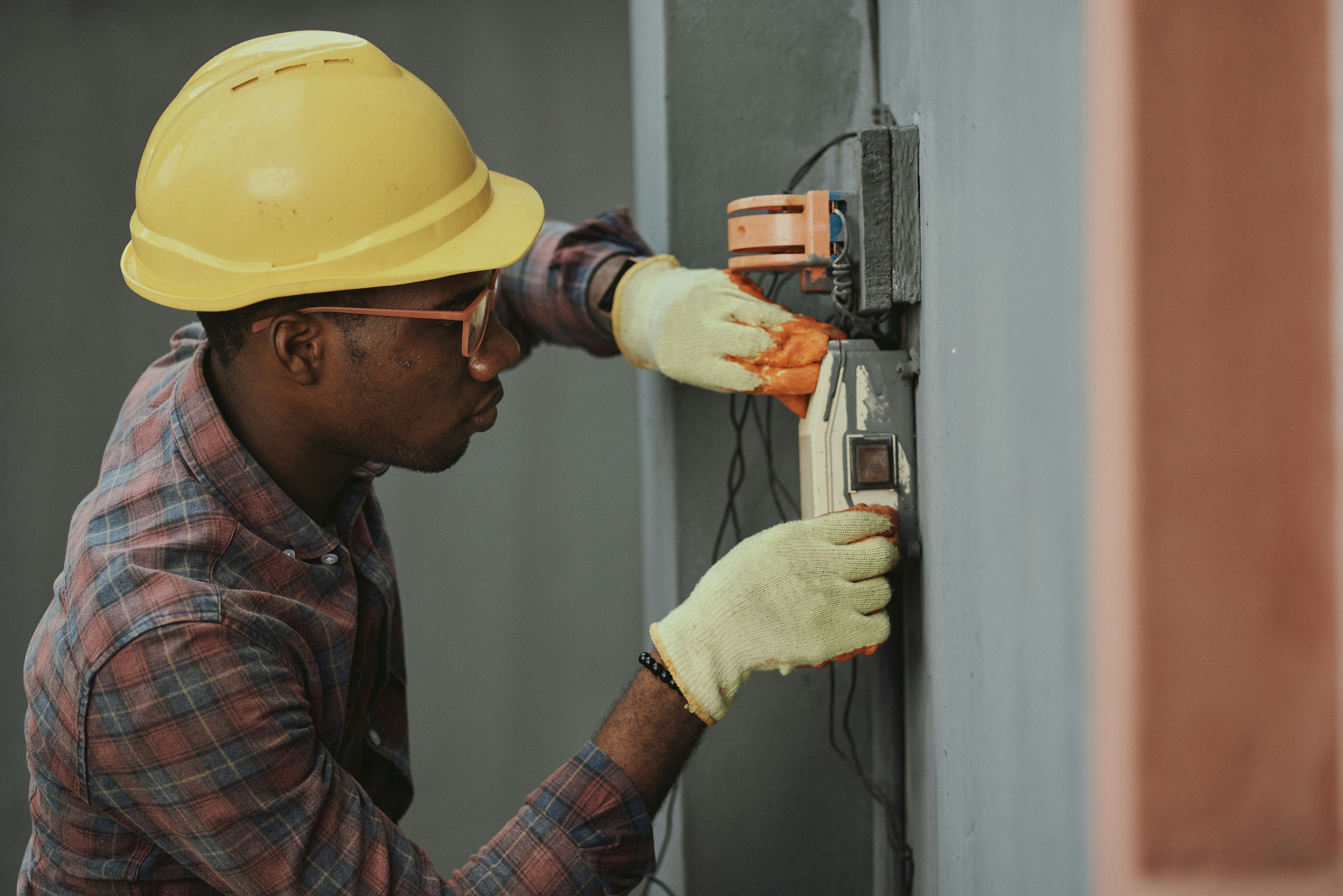 Electrician St Ives holding a master electrician certification at a Ku-ring-gai job site